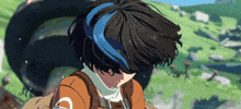 a girl with a blue stripe in her hair is wearing an orange shirt
