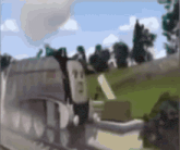a blurry picture of a train on the tracks