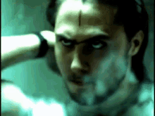 a man with a cross on his forehead is smoking
