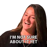 a woman is laughing with the words i 'm not sure about it yet behind her