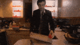 a man is cutting an apple on a cutting board