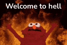 elmo from sesame street is standing in front of a fire with the words `` welcome to hell '' written on it .