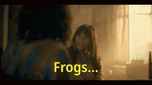 a man and a woman are talking to each other in a room .