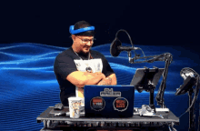 a man sitting in front of a dj racer laptop computer