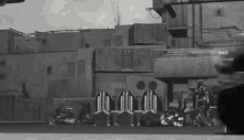 a black and white photo of a military base with a clock that says 10:08