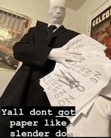a man in a suit and tie is holding a stack of papers with scissors on them