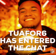 a man is smiling and holding a trophy with the words tuafor6 has entered the chat