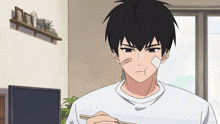 a man with a bandage on his face is eating a meal with chopsticks
