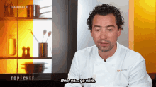 a man in a chef 's uniform says " bon ca ... ca chie "