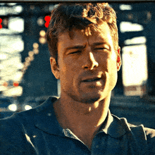 a close up of a man 's face with a blurred background