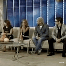 a group of people sitting on a couch with rbd.gif written on the bottom