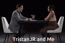 a man and a woman are sitting at a table with tristanjr and me written on the bottom