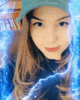 a woman wearing a hat and a necklace with the infinity symbol on it
