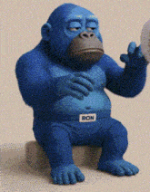 a blue gorilla with the name ron on his belt
