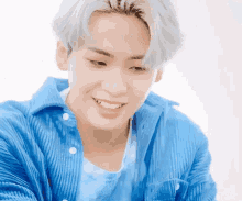 a close up of a person wearing a blue shirt