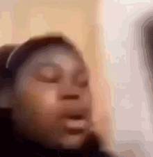 a blurry picture of a person 's face with their mouth open