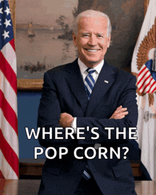 joe biden sitting at a desk with his arms crossed and the words where 's the pop corn written below him