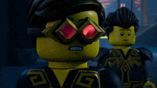 a lego figure wearing a pair of red goggles