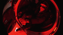 a person sitting in a car with red lights on