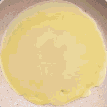 a pancake is being cooked in a pan that says mr.cakes on it