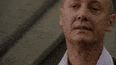 a close up of a man 's neck and ear with his eyes closed