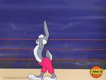 bugs bunny is flexing his muscles in a looney tunes cartoon