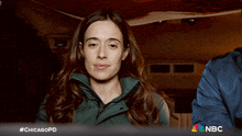 a woman with her eyes closed is on a nbc advertisement