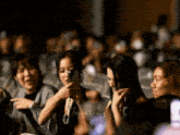 a woman taking a picture with a cell phone with the word filmatic on the bottom