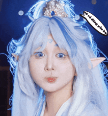 a woman with blue hair and a speech bubble that says " co co daing yếu ko "