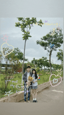 a boy and a girl holding a dog in front of a tree with the words " you are the only one "