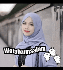 a woman wearing a hijab stands in front of a sign that says " awalikumsalam "