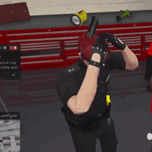 a man in a police uniform is holding a gun in his hand