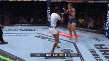 two women are fighting in a boxing ring and the ufc fight is being broadcast on espn