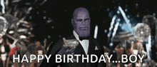 thanos is wearing a tuxedo and holding a gun and says `` happy birthday boy '' .