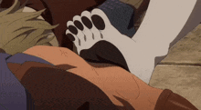 a person laying down with a paw on their shoulder