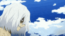 a cartoon character with white hair is standing in front of a blue sky with clouds .