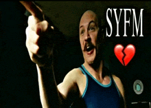 a man in a blue tank top is pointing at something with syfm written above him