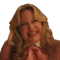 a woman wearing a pink shirt and a bow tie is smiling