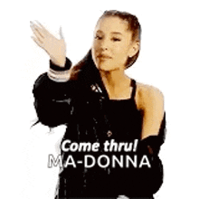 ariana grande is wearing a black tank top and a black jacket and is dancing .