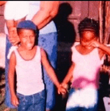 a boy and a girl are holding hands in a picture
