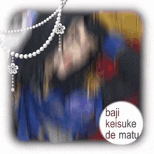 a blurry picture of a woman with the words baju keisuke de matu on the bottom right