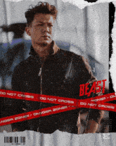 a man is standing in front of a red tape that says danger zone