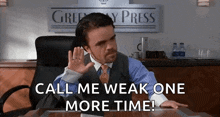 a man in a suit and tie is sitting at a desk and says call me weak one more time .