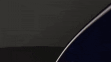 a close up of a metal object with a black background