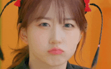 a close up of a woman making a face