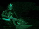 a man holding a gun in front of a picture of a woman