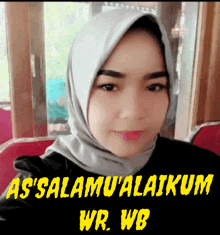 a woman wearing a hijab with the words as ' salamu ' alaikum wr wb written below her