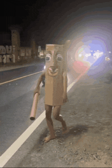 a person in a cardboard box costume walking down a street