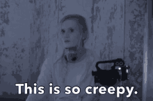 a woman holding a camera with the words " this is so creepy " below her