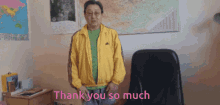 a man in a yellow jacket stands in front of a chair and says thank you so much